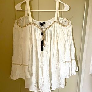 White flowing blouse with gold braided trim